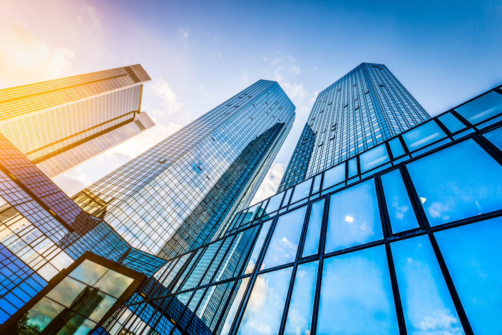 Bottom,View,Of,Modern,Skyscrapers,In,Business,District,At,Sunset